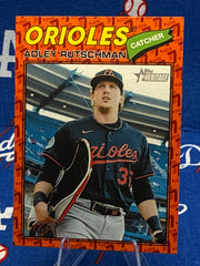 2025 Topps Heritage Adley Rutschman Through the Years Insert #180 Baltimore Orioles Raw